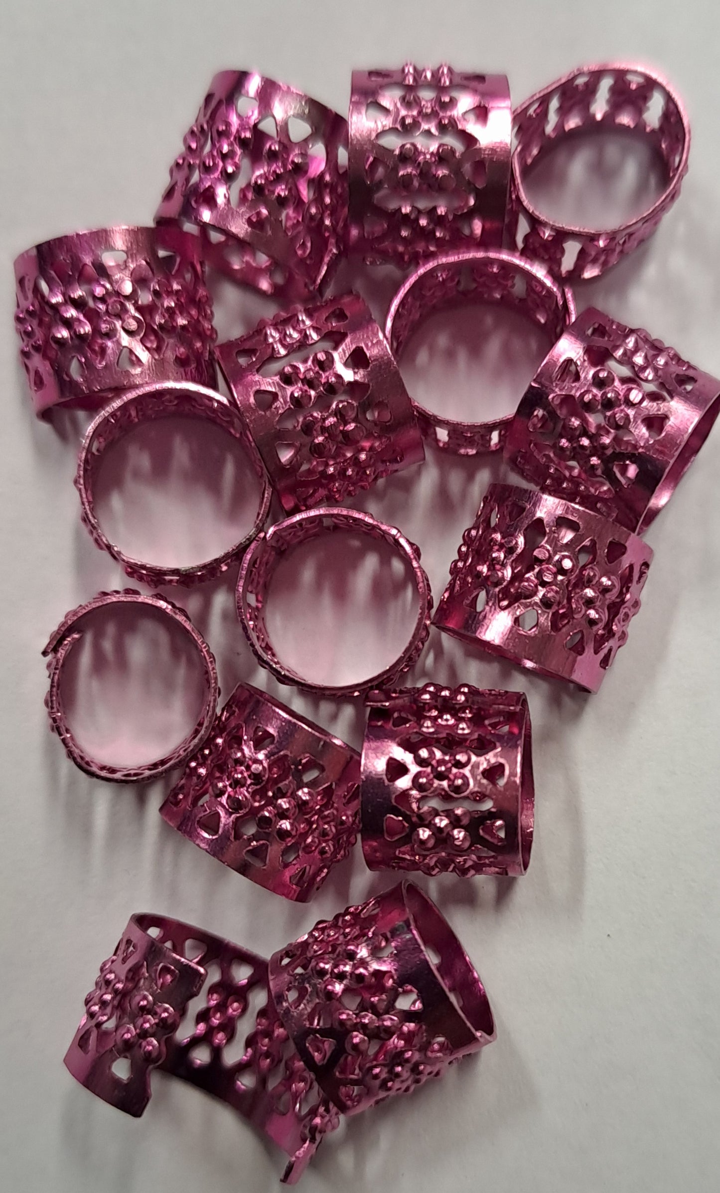 Anelli corti per capelli regolabili colore fucsia. 20 pz