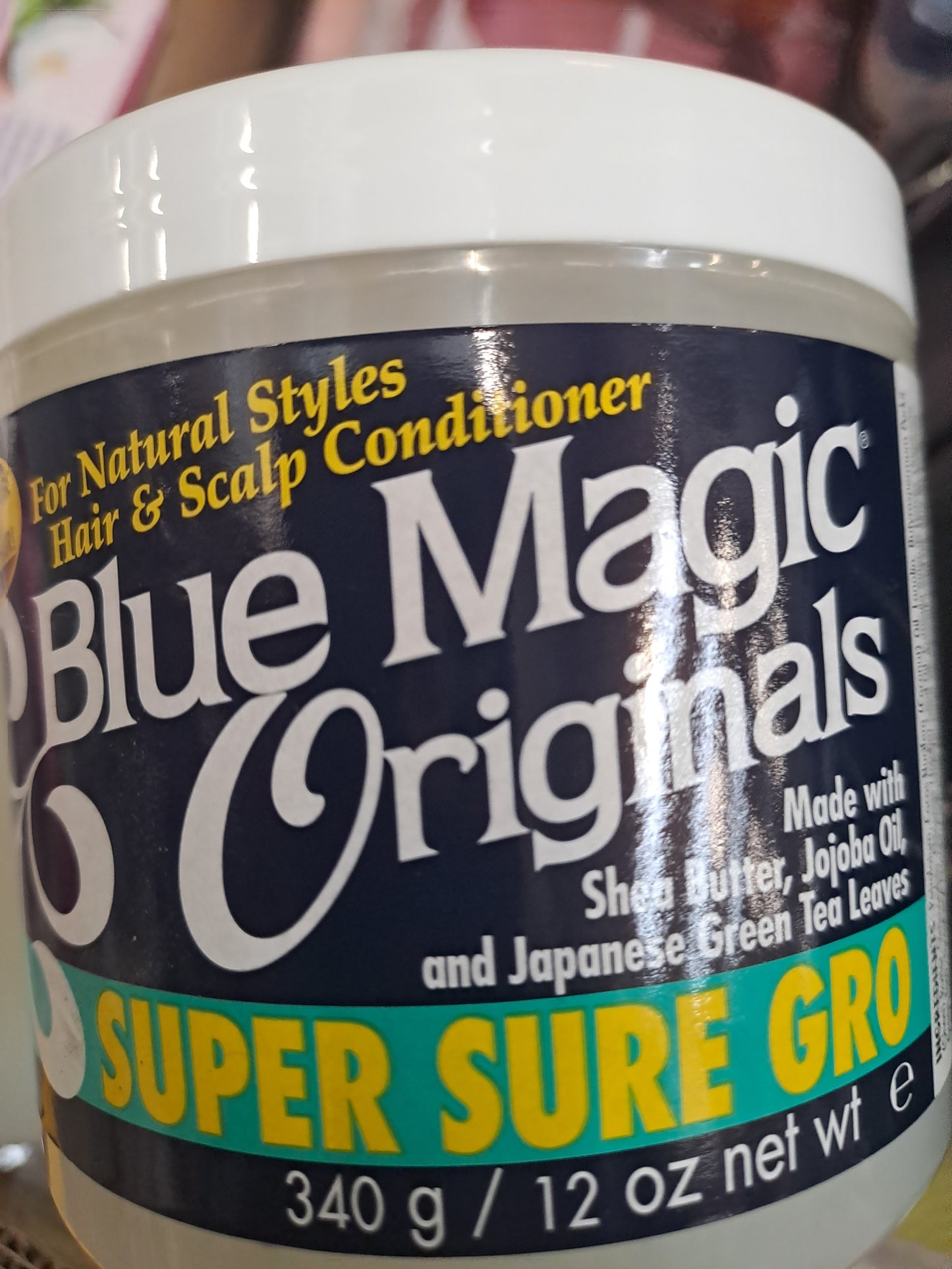 Blue Magic Originals super sure gro. With shea butter, jojoba oil and Japanese Green Tea Leaves.